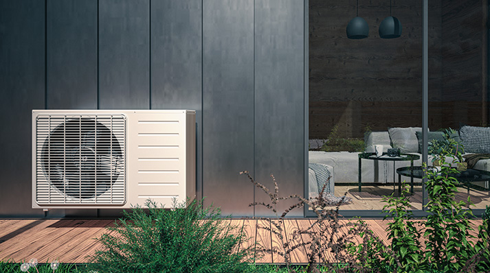Air source heat pump installation beside a modern home in Glasgow.